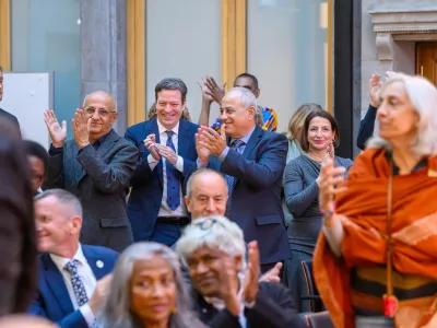 Richard von Weizsäcker Fellows standing and clapping following a keynote address at the Richard von Weizsäcker Forum