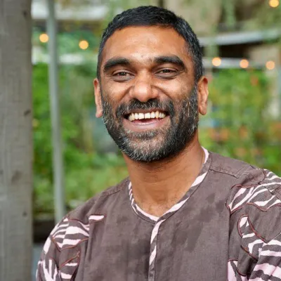 Richard von Weizsäcker Fellow Kumi Naidoo laughing into the camera